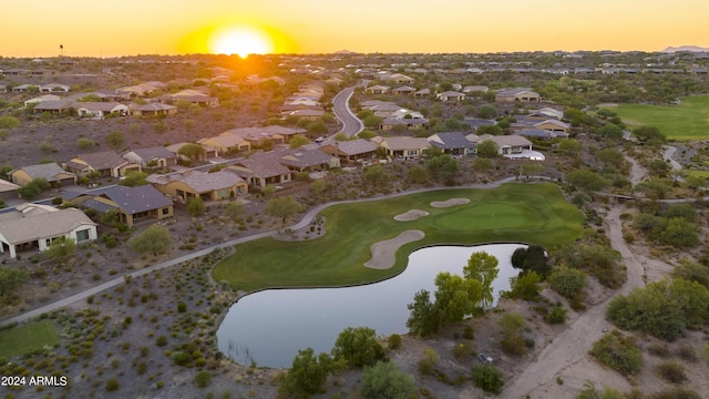 aerial view at dusk with a water view