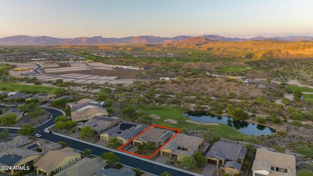 aerial view at dusk with a water and mountain view