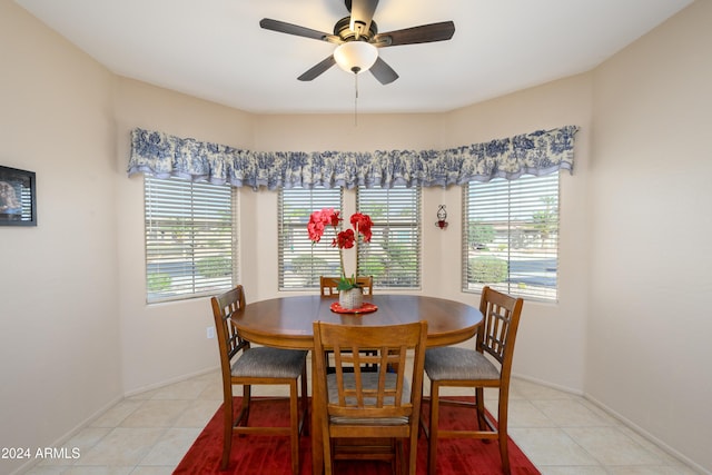 tiled dining room with ceiling fan and a wealth of natural light