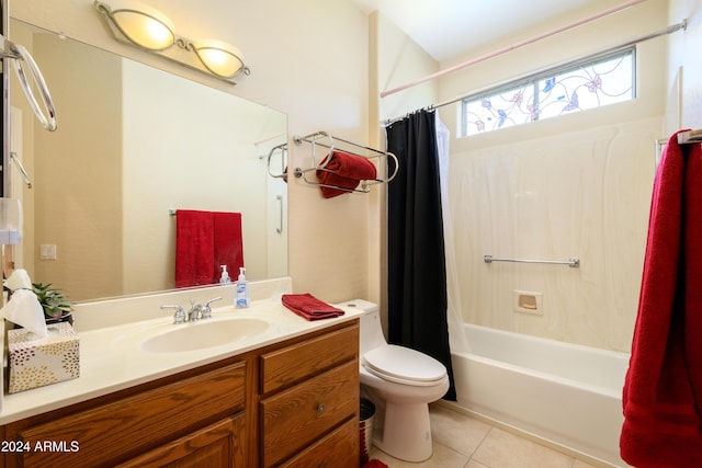 full bathroom featuring toilet, vanity, tile patterned floors, and shower / bathtub combination with curtain