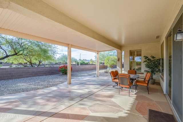 16933 W Oasis Springs Way, Surprise, AZ 85387 - fenced backyard with a patio area and outdoor dining area