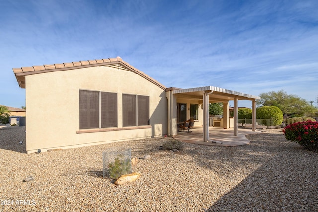 16933 W Oasis Springs Way, Surprise, AZ 85387 - rear view of house featuring a patio and stucco siding