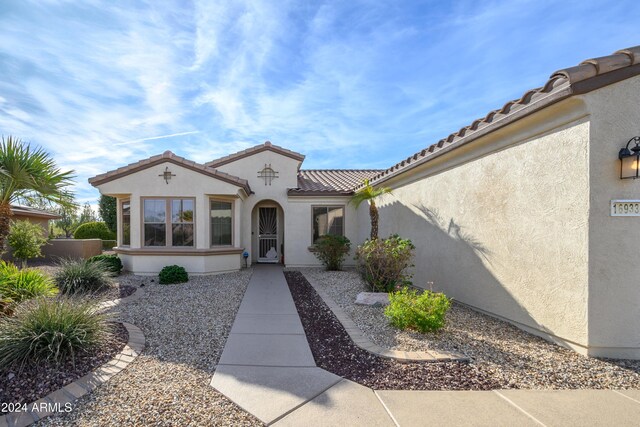 16933 W Oasis Springs Way, Surprise, AZ 85387 - property entrance featuring stucco siding and a tiled roof