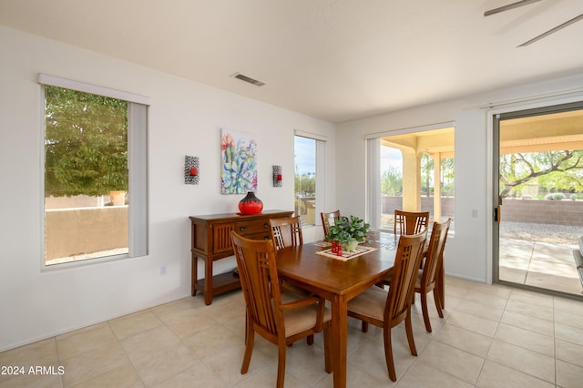 dining area featuring light tile patterned floors and ceiling fan