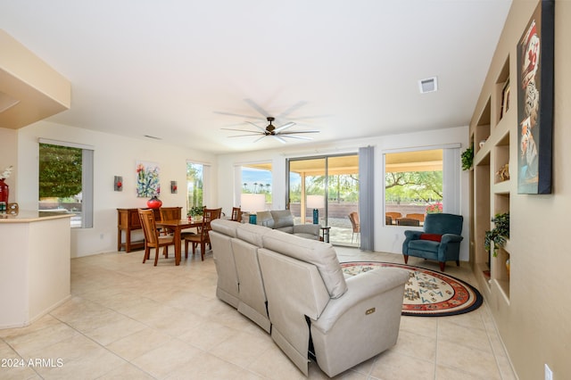 living room with light tile patterned floors and ceiling fan