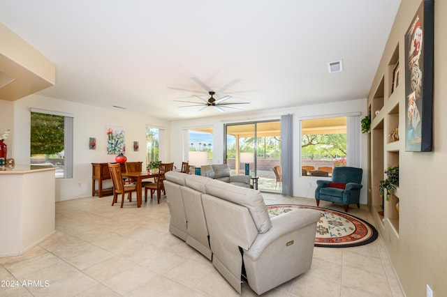 16933 W Oasis Springs Way, Surprise, AZ 85387 - living room with a ceiling fan and light tile patterned floors