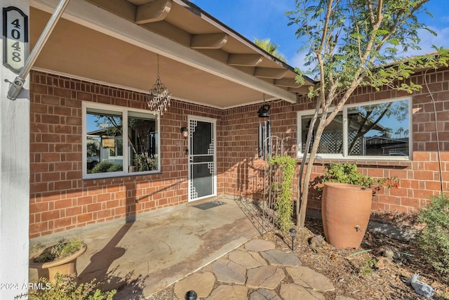 doorway to property featuring a patio area