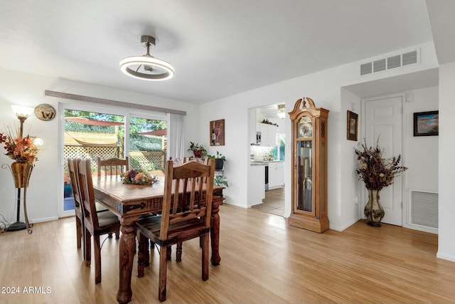 dining space featuring light wood-type flooring