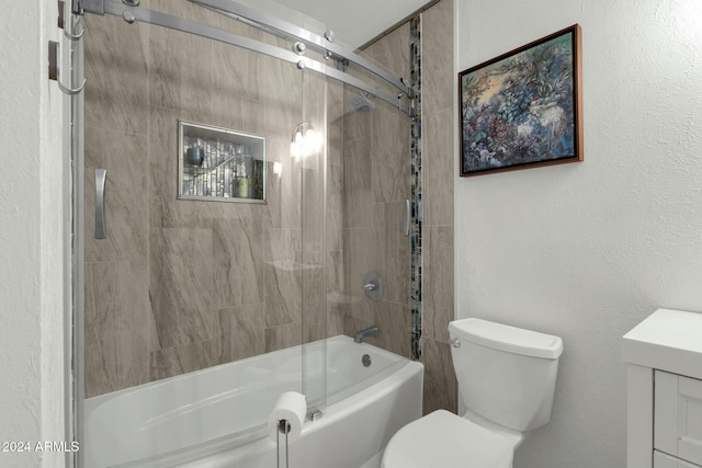 bathroom featuring combined bath / shower with glass door and toilet