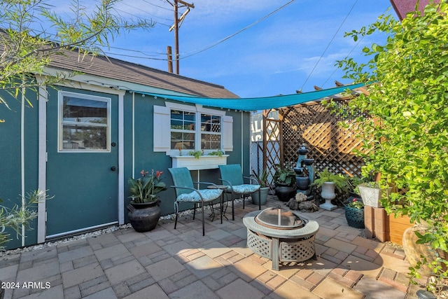 view of patio featuring an outdoor fire pit