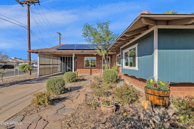 exterior space featuring solar panels