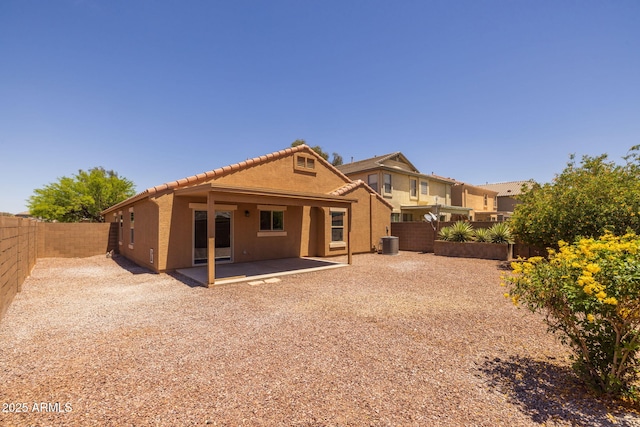 3843 E Citrine Rd, San Tan Valley, AZ 85143 - back of property featuring a fenced backyard, central AC, a tiled roof, a patio, and stucco siding