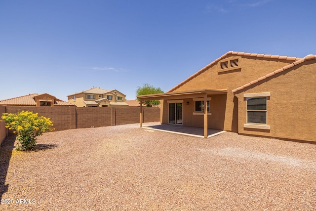 3843 E Citrine Rd, San Tan Valley, AZ 85143 - back of house featuring a fenced backyard, a patio, stucco siding, and a tiled roof