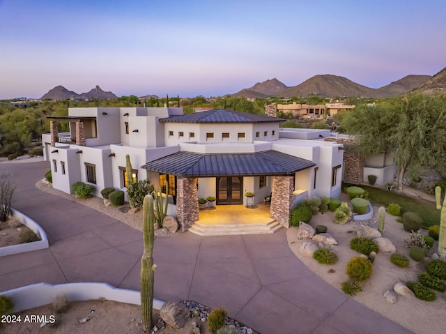 pueblo-style house with a mountain view