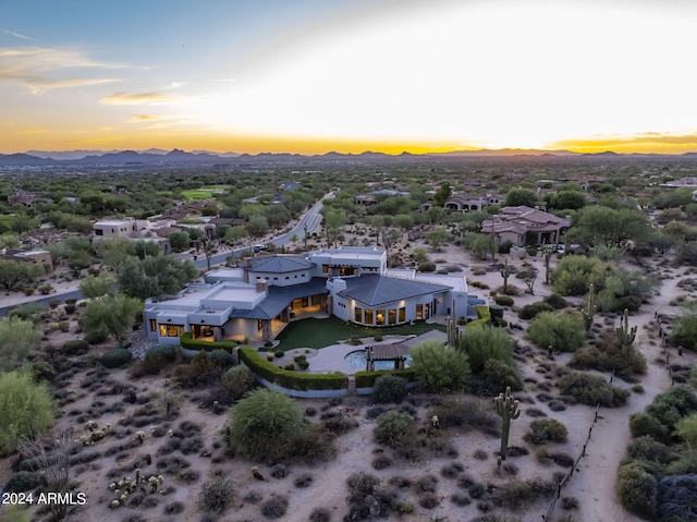 birds eye view of property featuring a mountain view