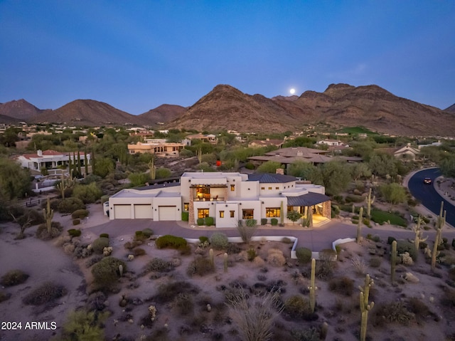 birds eye view of property with a mountain view