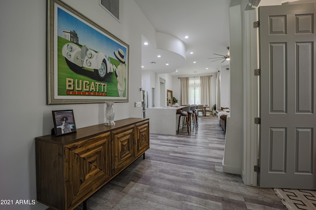 hall with hardwood / wood-style floors