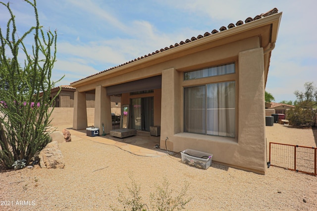 rear view of house featuring a patio