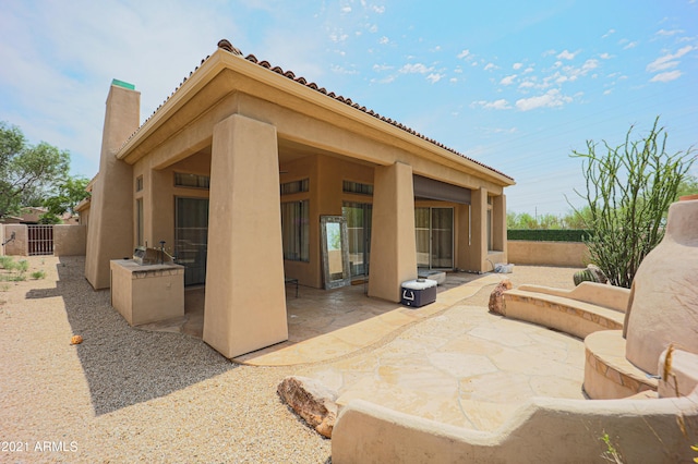 back of house featuring a patio