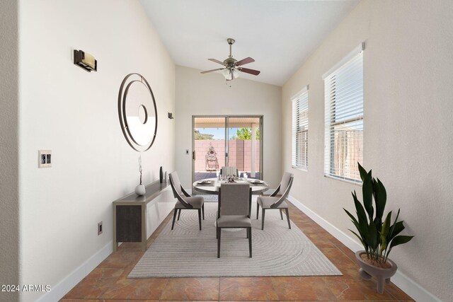 dining space featuring vaulted ceiling and ceiling fan