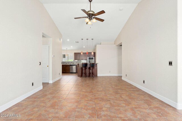 unfurnished living room featuring high vaulted ceiling, ceiling fan, and light tile patterned flooring