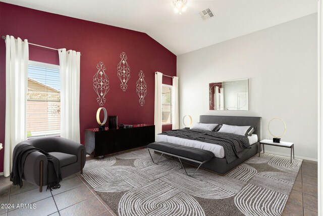 bedroom featuring vaulted ceiling and tile patterned floors