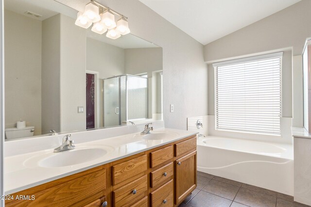 full bathroom with vanity, lofted ceiling, toilet, independent shower and bath, and tile patterned flooring