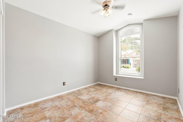 empty room with vaulted ceiling and ceiling fan