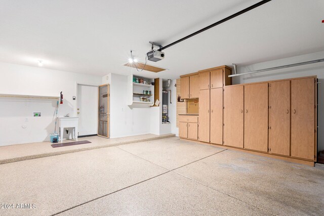 garage featuring gas water heater and a garage door opener