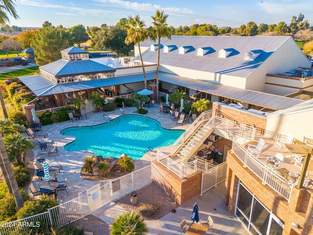 view of swimming pool with a patio area