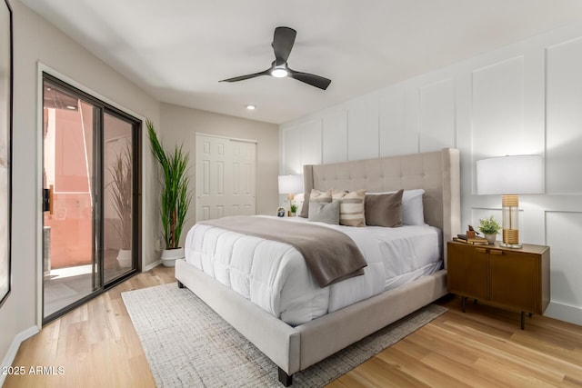 12222 N Paradise Village Pkwy S Unit 237, Phoenix, AZ 85032 - bedroom featuring light wood-style floors, access to exterior, a ceiling fan, and a closet