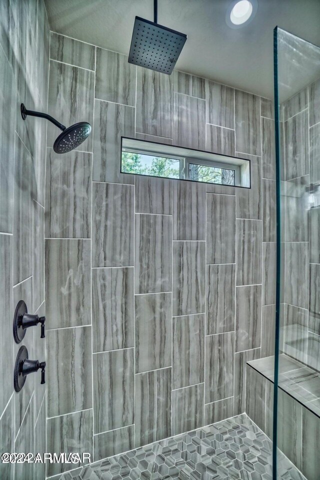 bathroom with tiled shower