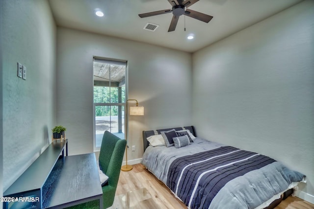 bedroom featuring light wood-type flooring and ceiling fan