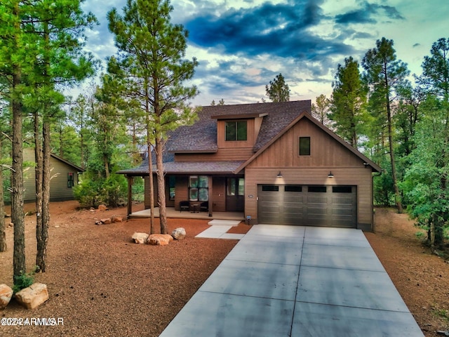 view of front of property featuring a garage and a porch