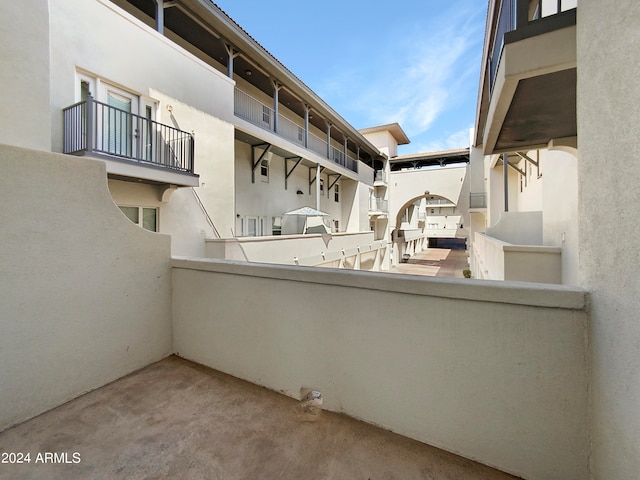 view of patio with a balcony