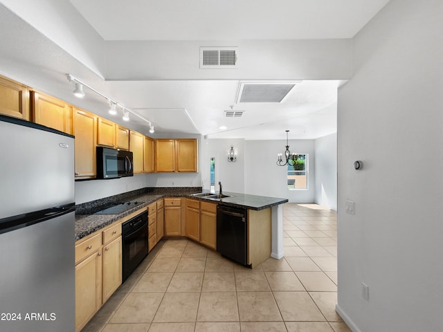 kitchen with hanging light fixtures, kitchen peninsula, light tile patterned floors, black appliances, and sink