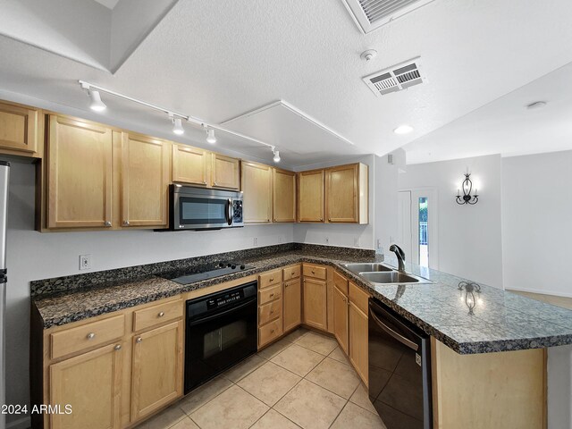 kitchen featuring a textured ceiling, track lighting, sink, kitchen peninsula, and black appliances