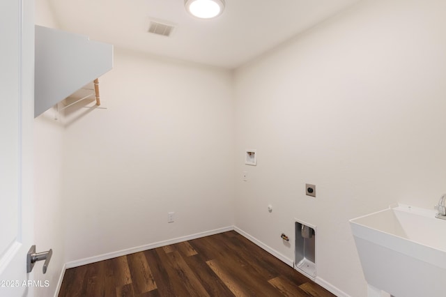 laundry room with washer hookup, gas dryer hookup, sink, dark wood-type flooring, and electric dryer hookup