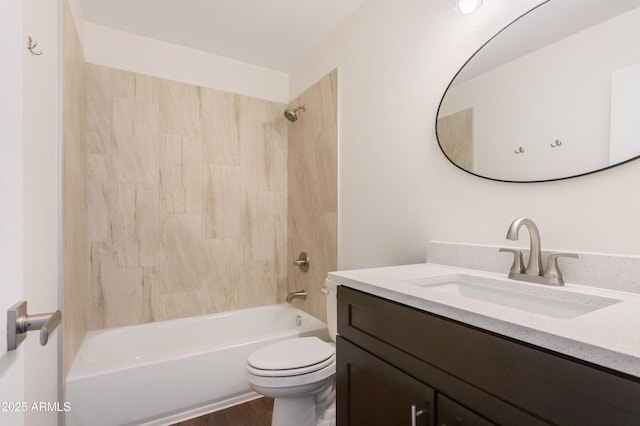 full bathroom featuring washtub / shower combination, vanity, and toilet