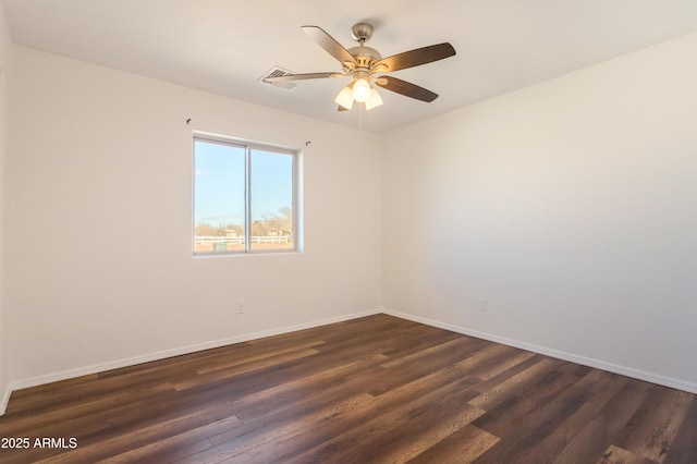 unfurnished room featuring ceiling fan and dark hardwood / wood-style flooring