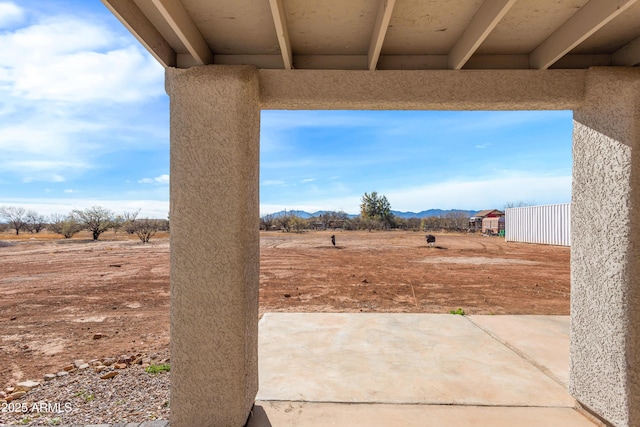 view of patio with a mountain view