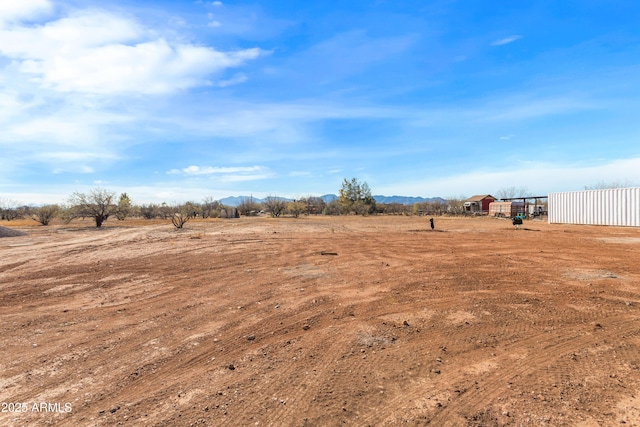 view of yard with a rural view