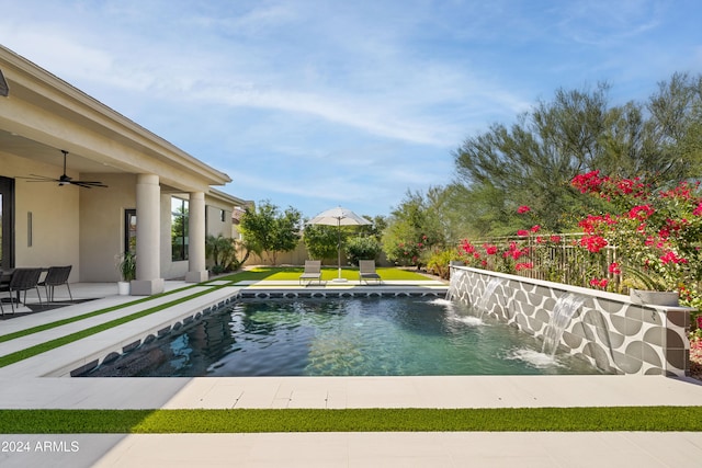 view of swimming pool featuring ceiling fan, a patio area, fence, and a fenced in pool