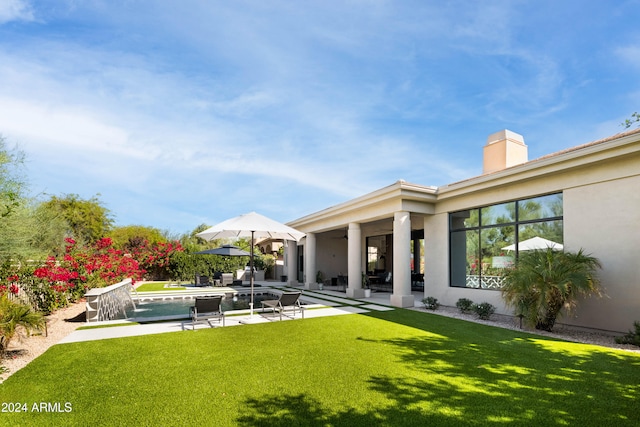 view of yard with a patio and a pool