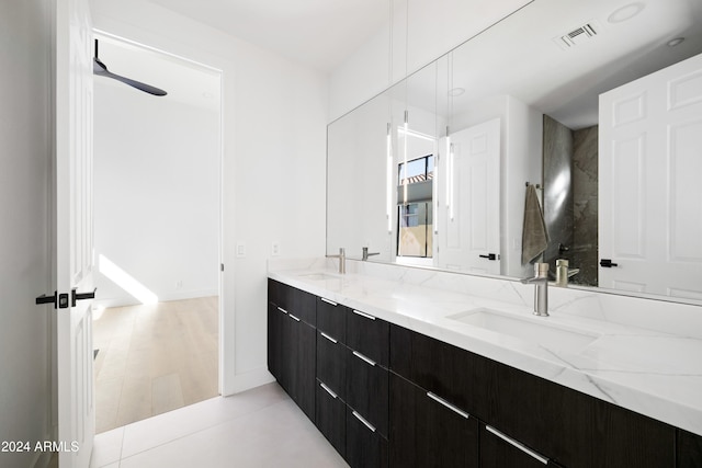 full bathroom with double vanity, a sink, visible vents, and tile patterned floors