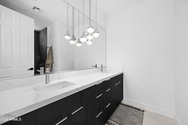 bathroom with tile patterned flooring and vanity