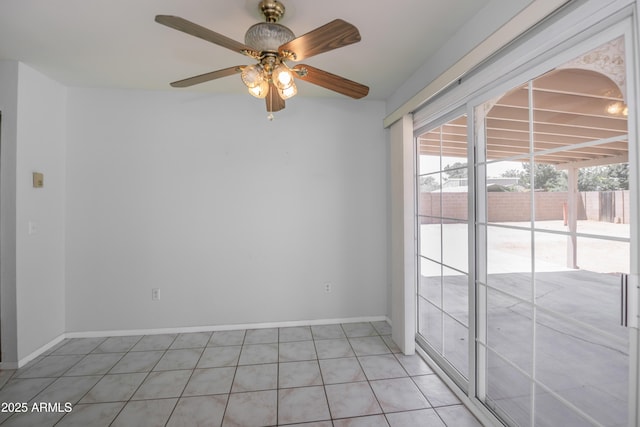 3098 N Starlight Dr, Prescott Valley, AZ 86314 - empty room with light tile patterned floors, a ceiling fan, and baseboards