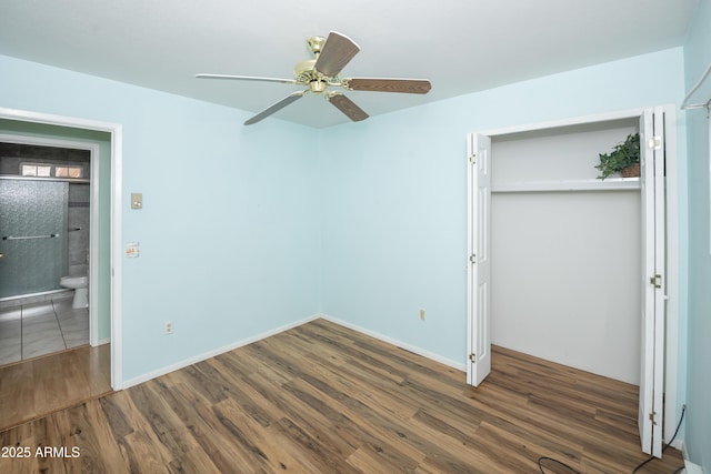 3098 N Starlight Dr, Prescott Valley, AZ 86314 - unfurnished bedroom featuring wood finished floors, a closet, ceiling fan, and baseboards
