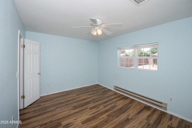 3098 N Starlight Dr, Prescott Valley, AZ 86314 - unfurnished room featuring baseboard heating, wood finished floors, a ceiling fan, and baseboards