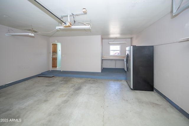 3098 N Starlight Dr, Prescott Valley, AZ 86314 - garage with freestanding refrigerator and a garage door opener
